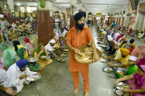 Pilgrims enjoying enjoying tasty food ( free of cost )